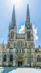 Fototapeta na wymiar Bordeaux, France, 9 may 2018 - tourist passing the Famous Cathédrale Saint-André de Bordeaux