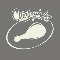 Silhouette of chicken leg against dark background and inscription