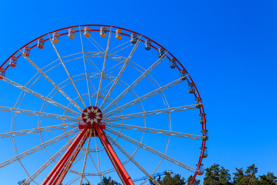 Ferris wheel on background of blue sky in Gorky Park. Kharkov, Ukraine