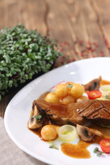 juicy steak with potato and vegetables