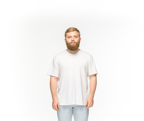 Closeup of young man's body in empty white t-shirt isolated on white background. Mock up for disign concept