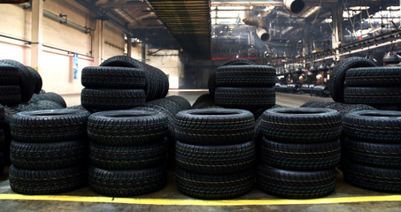 Stacking vehicle tires on the plant floor after production on rubber manufacture    © AnyVIDStudio
