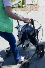 senior lady rollator hands on handle