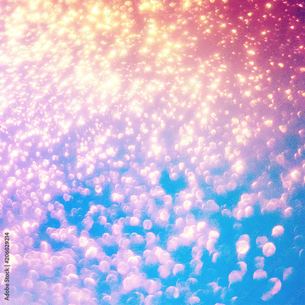 Wall mural glittering christmas abstract background with magic bokeh lights. holographic abstract fantasy backd