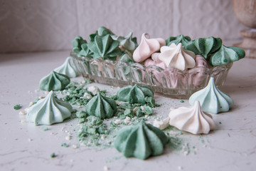 Meringue dessert. Freshly baked sweets made of eggs and sugar. Crispy cookies. Bright colors