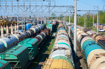Many freight oil cars at the station.
