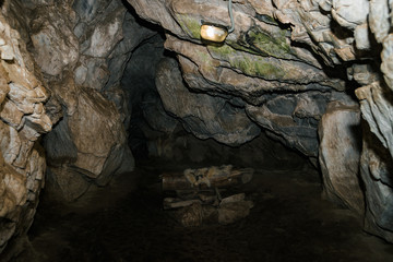 Beautiful cave. View from inside dark dungeon. Textured walls of cave. Background image of...