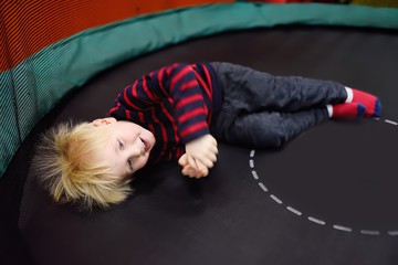 Fanny little boy after activity on trampoline
