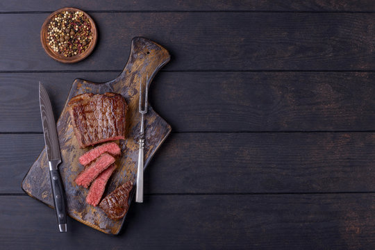 Sliced Steak On Cutting Board