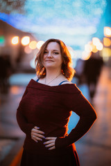 Fototapeta premium young woman posing on street background