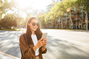 Obraz premium Amazing happy beautiful woman using mobile phone.