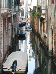 Many houses near the narrow water way in Venice Italy