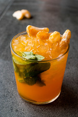 Mandarin Mojito Cocktail with Mint Leaves and Crushed Ice / Tangerine or Clementine