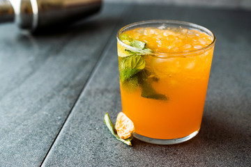 Mandarin Mojito Cocktail with Mint Leaves and Crushed Ice / Tangerine or Clementine