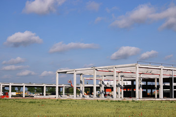 Obraz premium factory construction site with workers industry zone