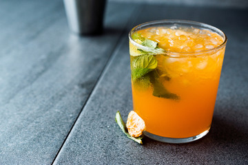 Mandarin Mojito Cocktail with Mint Leaves and Crushed Ice / Tangerine or Clementine