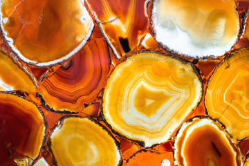 A beautiful red agate stone. A panel made of yellow agate.