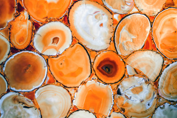 A beautiful red agate stone. A panel made of yellow agate.