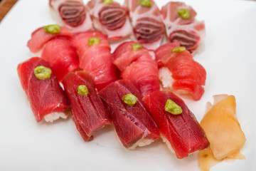 fat tuna sushi on white plate
