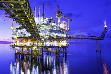 Fototapeta premium Oil and gas offshore platform on night time.