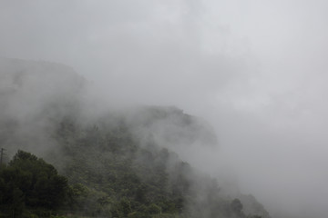 The fog descended on a mountain village. Rain.