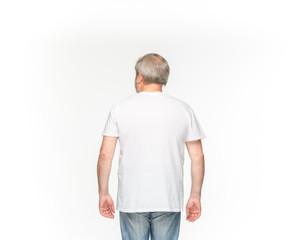 Fototapeta premium Closeup of senior man's body in empty white t-shirt isolated on white background. Mock up for disign concept