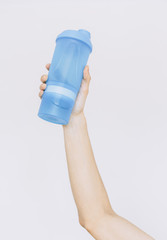 A man is holding a shaker in his hand. Іsolated white background