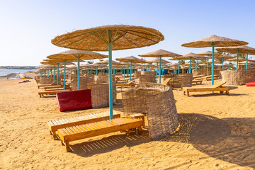 Parasols on the beach of Red Sea in Hurghada, Egypt