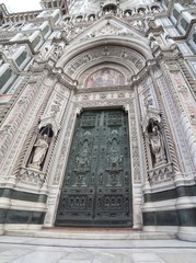 Florence Italy gate with decorations and artistic statues in the