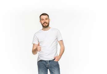 Fototapeta premium Closeup of young man's body in empty white t-shirt isolated on white background. Mock up for disign concept