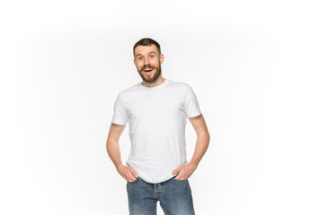 Fototapeta premium Closeup of young man's body in empty white t-shirt isolated on white background. Mock up for disign concept