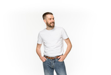 Fototapeta premium Closeup of young man's body in empty white t-shirt isolated on white background. Mock up for disign concept