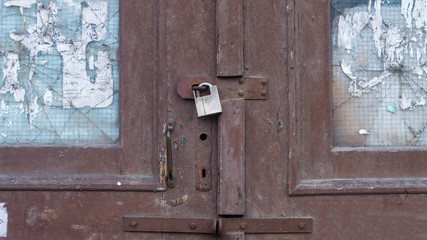 old painted door with lock. glass appeared