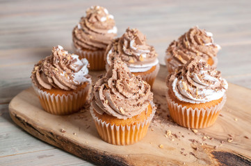 Vanilla cupcakes with chocolate cream end topping. homemade baking