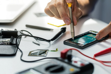 technician repairing broken phone