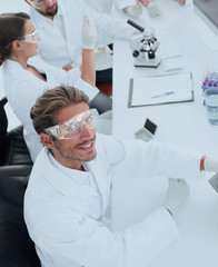 view from the top.modern young scientist sitting at workplace