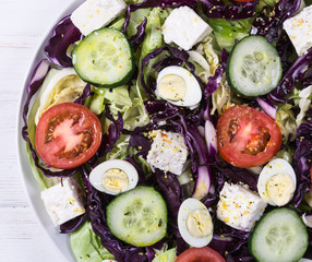 Salad with cabbage and quail eggs
