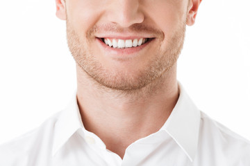 Close up of happy man's toothy smile