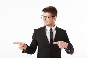 Portrait of a happy young businessman in suit