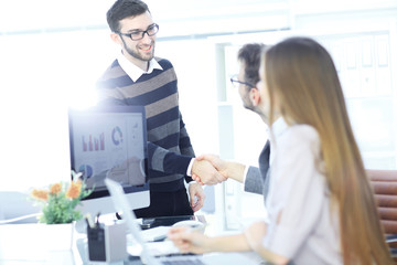 client welcomes the Manager with a handshake