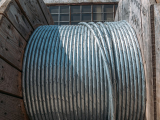 Obraz na płótnie Canvas Steel metal coil wire, industrial roll cable