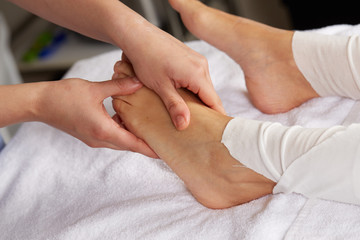 Fototapeta na wymiar thai foot massage in spa club