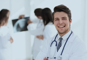 Fototapeta premium young doctor on the background of colleagues