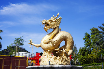Fototapeta premium Old street fountain with golden sea Dragon, Phuket, Thailand