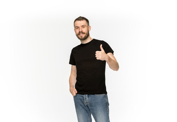 Closeup of young man's body in empty black t-shirt isolated on white background. Mock up for disign concept