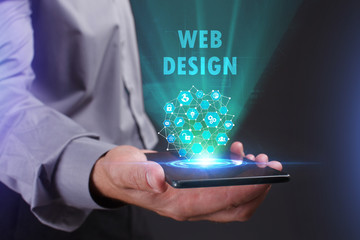 The concept of business, technology, the Internet and the network. A young entrepreneur working on a virtual screen of the future and sees the inscription: Web design