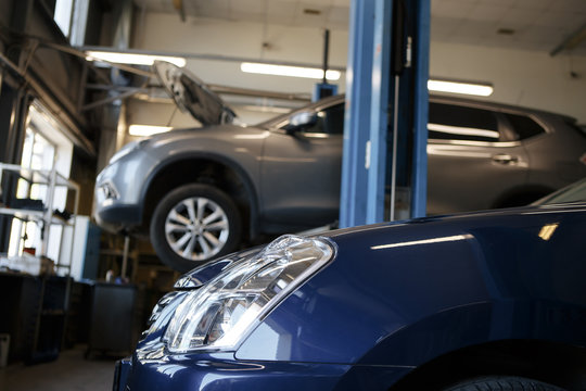 black car repair station with soft-focus in the background and over light