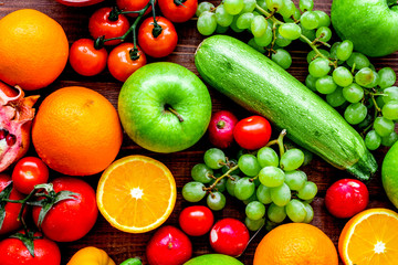 fresh vegetables and fruits for fitness dinner on wooden backgro