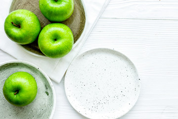 green apples for healthy dessert on white background top view