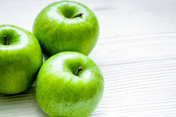 Healthy green food with apples on kitchen white background